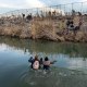 An aerial view of migrants crossing the Rio Grande.