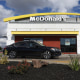 A car drives in front of a McDonald's restaurant on February 6, 2024, in San Leandro, Calif.