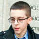Middle schooler Liam Morrison speaks outside of the U.S. Court of Appeals for the First Circuit in Boston on Thursday morning, Feb. 8, 2024. His attorney, David Cortman, looks on.