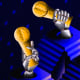 Drawn illustration of robotic hands holding gold trophies for first, second and third places.