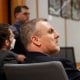 Brian Steven Smith watches proceedings during the opening day of his double murder trial on Feb. 6, 2024, in Anchorage, Alaska. 