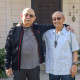 Brothers Lloyd Dong Jr., left, and his brother Ron stand outside of their childhood home on C Street in Coronado. 