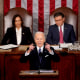 President Biden delivers his State Of The Union address with Kamala Harris and Mike Johnson seated behind him.