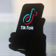 The TikTok logo on a mobile device.