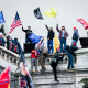 Rioters wave flags at the U.S. Capitol