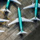 An aerial photo shows Boeing 737 MAX airplanes parked on the tarmac outside