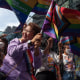 Participants seen waving rainbow flags during the Bangkok