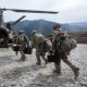 U.S. soldiers board an Army Chinook transport helicopter