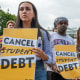 From left, Sabrina Calazans, Aiden Thompson and Sydney Stokes, rally with other student loan debt activists outside the White House