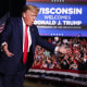 Donald Trump greets supporters during a rally