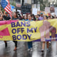 Demonstrators march in the rain during an abortion rights rally