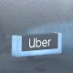 An Uber sign displayed inside a car