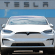 A Tesla Model X sits at dealership  in Englewood, Colo., in 2023. 