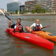 Kayakers Paul Maakad and Vincent Darnet on the Seine river in Paris.