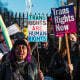 Trans rights activists attend a protest in London