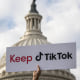 A person holds a sign supporting TikTok at the U.S. Capitol.