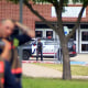 Police at the scene of a shooting at Bowie High School in Arlington, Texas.