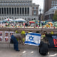 People set up a makeshift memorial for the Israeli hostages held by Hamas next to the 