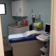 empty abortion clinic room examination table