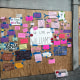 Neighbors post supportive notes on the boarded up exterior Terry Williams’ home