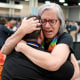 Angie Cox, left, and Joelle Henneman hug after an approval vote at the United Methodist Church General Conference