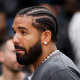 Drake leaves the court after the NBA game between the Toronto Raptors and the Los Angeles Lakers at Scotiabank Arena in Toronto