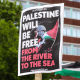 A protester holds a sign saying "Palestine Will Be Free From The River to the Sea"