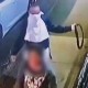 Surveillance video a man throwing a belt around woman's neck