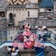 Actors dressed as Walt Disney characters Minnie Mouse and Mickey Mouse perform during a press preview for the 