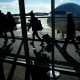 Thanksgivng Holiday travel at Washington Dulles Airport in Virginia travelers silhouette shadows