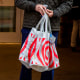 A shopper carries Target bags.