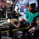 A Palestinian wounded in an Israeli bombardment on the Gaza Strip is brought to Al Aqsa hospital in Deir al Balah