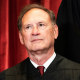 Associate Justice Samuel Alito sits during a group photo of the Justices at the Supreme Court in Washington, DC on April 23, 2021.