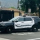 Azusa, California, police vehicles outside a home. 