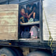 A group of Guatemalan migrant children travel in a crowded cargo truck in the town of Yanga, Veracruz, on October 19, 2023.