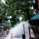 Water gushes out of a broken water transmission line in downtown Atlanta