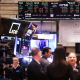 Stock market numbers are seen as traders work on the floor of the New York Stock exchange