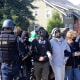 Pro-Palestinian demonstrators face off against police in riot gear at the University of Santa Cruz 
