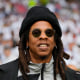 Jay Z smiles  at Wembley stadium