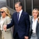 Hunter Biden holds his mother and wife's hand as they walk out of the courthouse