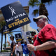 Striking writers and actors picket outside Paramount studios in Los Angeles