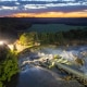 Long-exposure drone photo shows a home as it teeters before partially collapsing into the Blue Earth River at the Rapidan Dam