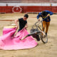 Image: Colombian "novillero" David Rodriguez, 29, left, trains at the bullring