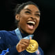 Image: simone biles gold medal gymnastics laugh smile happy