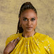 Ava DuVernay poses for a photograph among yellow flowers on a set