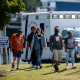 Students and parents in front of an emergency vehicle