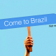 Photo illustration of hand holding a sign that reads "Come to Brazil" with a "Not sent" error message next to it 