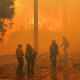 Firefighters work in hazy conditions during a wildfire