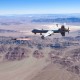 An Air Force MQ-9 Reaper fires a missile over the Nevada Test and Training Range at Nellis Air Force Base, on Aug. 30, 2023.