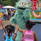 A costumed character appears to snub two Black girls at Sesame Place in Philadelphia in 2022. 